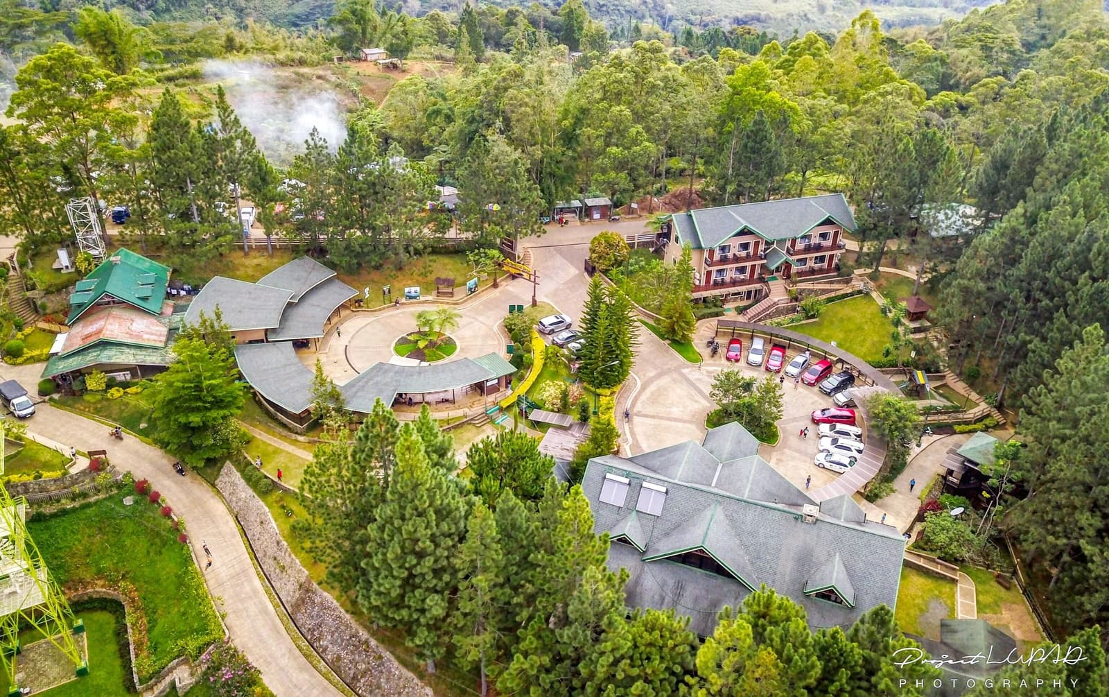 Aerial view of Dahilayan Forest Park buildings, pine trees and winding paths, photographed by Project LUPAD
